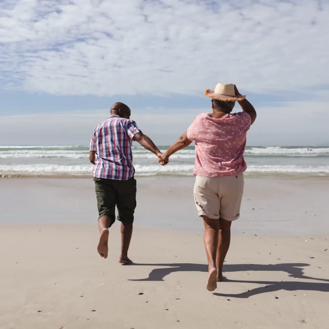 rear-view-senior-african-american-couple-holding-hands-running-beach-travel-vacation-retirement-lifestyle-concept_36_11zon