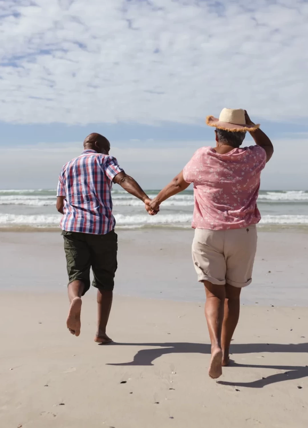 rear-view-senior-african-american-couple-holding-hands-running-beach-travel-vacation-retirement-lifestyle-concept_36_11zon